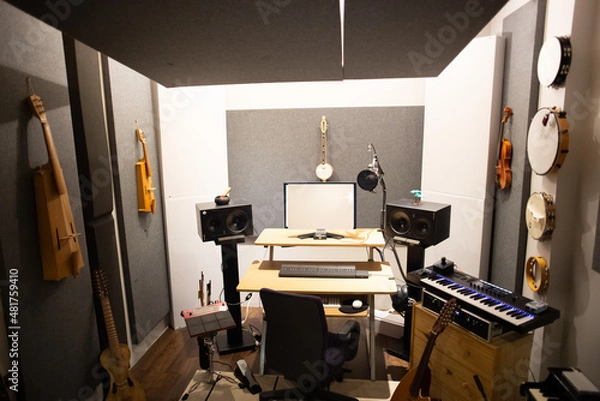 Fototapeta Music studio full of instruments and pc display