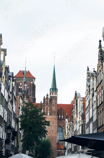 Fototapeta POLAND, GDANSK: Scenic cityscape view of city old center with traditional colorful architecture and red cathedral