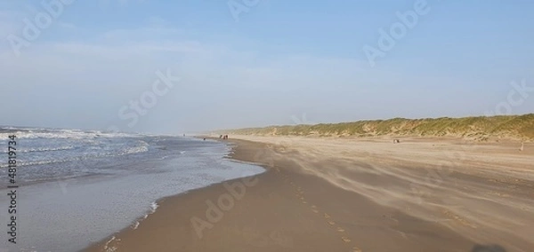 Fototapeta Sint Maartenszee Netherlands October 2021 Beach view in beautiful stormy weather with blue sky before sunset