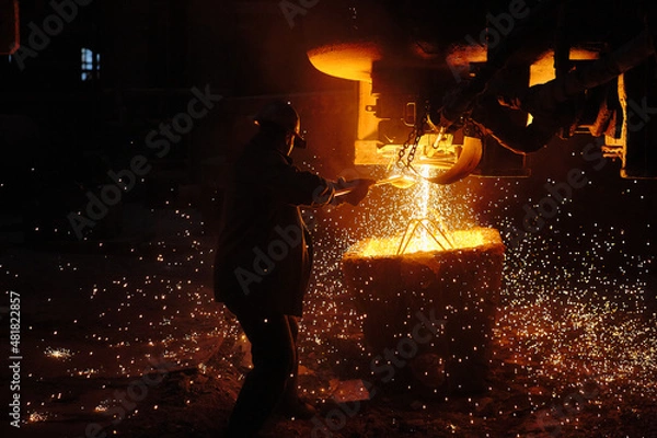 Obraz Metallurgist steelmaker takes a sample of liquid metal from a ladle. Ingot casting. Steel production. Metallurgy. Industry