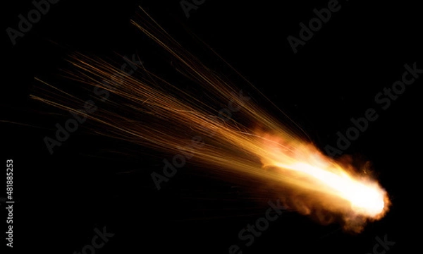 Fototapeta texture of a falling comet with sparks, smoke and a trail of particles, isolated on a black background