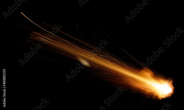 Fototapeta texture of a falling comet with sparks, smoke and a trail of particles, isolated on a black background