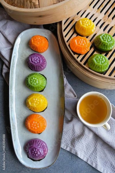 Obraz Common Malaysian Chinese street food snacks. Colorful Bite Size Ang Ku Kueh aka Tortoise Cake. Made from glutinous rice flour filled with mung bean paste, eaten during festive seasons and celebrations