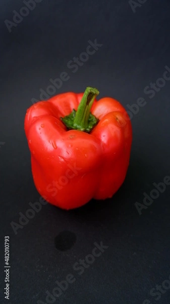 Fototapeta red pepper ON A BLACK BACKGROUND