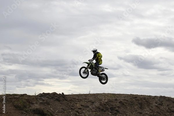 Fototapeta motocross rider in action, biker