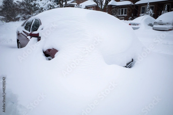 Obraz Toronto, Ontario / Canada - January 17, 2022 - Toronto St Clair West car covered with snow on day of snowstorm