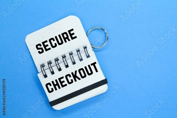 Fototapeta small notebook with the word secure checkout