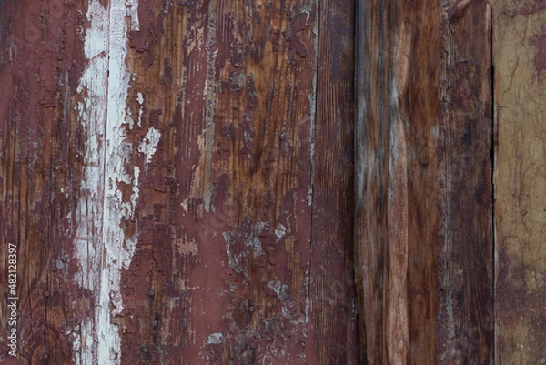 Fototapeta old boards from fences and gates are covered with dirt and old paint