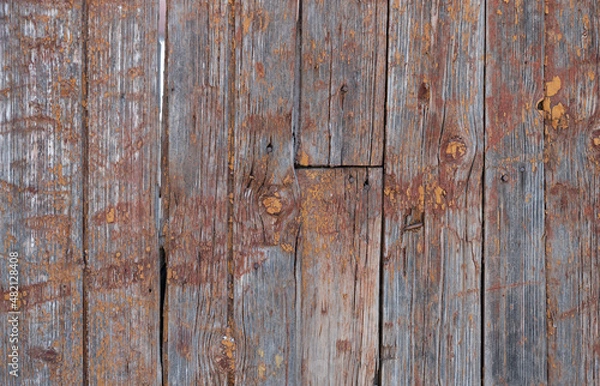 Fototapeta old boards from fences and gates are covered with dirt and old paint