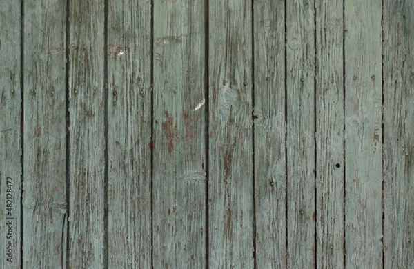 Fototapeta old boards from fences and gates are covered with dirt and old paint