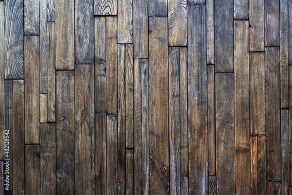 Fototapeta old boards from fences and gates are covered with dirt and old paint