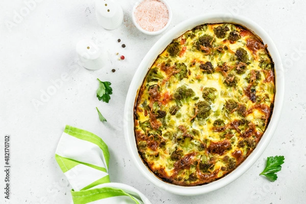 Obraz Vegetable chicken broccoli casserole in baking dish. Top view.