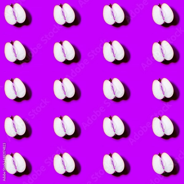 Fototapeta Juicy healthy Apple pattern on bright purple background. Minimal flat lay food texture. Summer abstract trendy fresh concept.