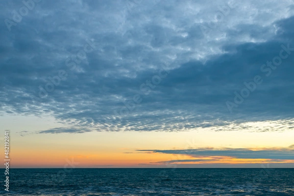 Fototapeta seascape with evening sky and clouds
