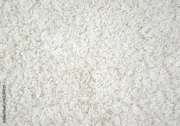 Obraz The texture of the carpet. Beige and white carpet, top view, long pile. Background