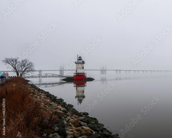 Obraz Lighthouse and bridge in the mist