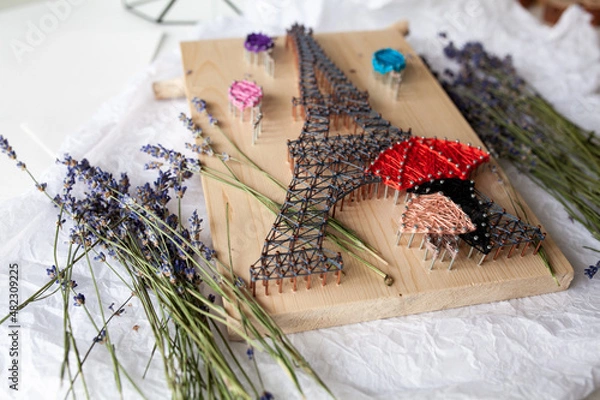 Obraz Wooden panel in string art technique, thread pattern, handmade