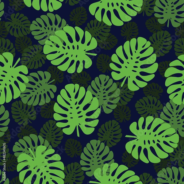 Obraz Seamless pattern with the image of the leaves of the monstera on a dark blue background