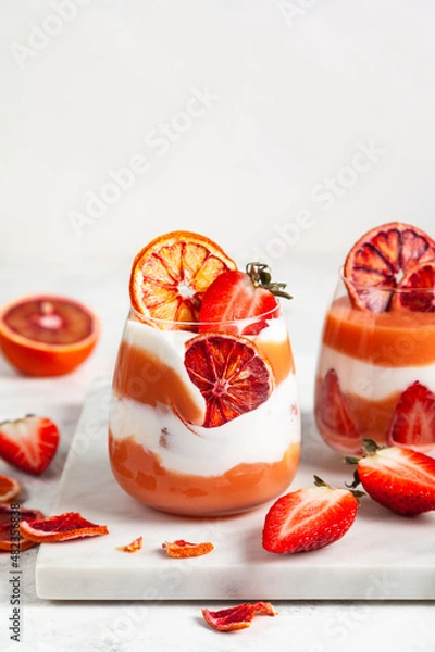 Fototapeta Layered trifle dessert with blood oranges cream Kurd.