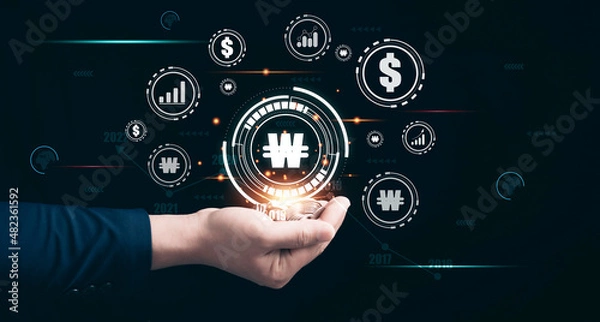 Obraz Human hands holding coin with Currency Icon. Investment growth concept.Korean Won,Dollar.