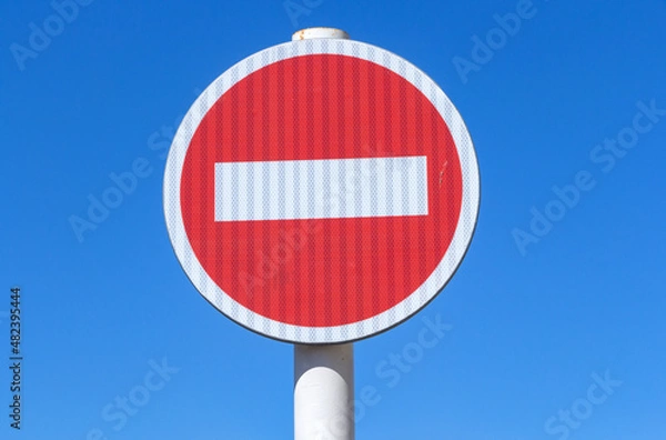 Obraz Small-shaped stop sign on a blue background