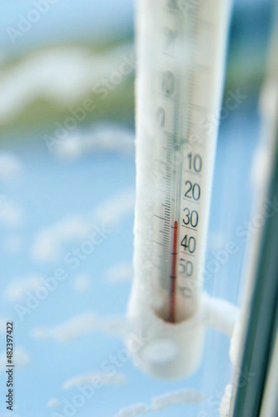 Fototapeta Classic mercury thermometer for measuring ambient temperature, hanging outside the window, with readings minus 30 degrees Celsius.