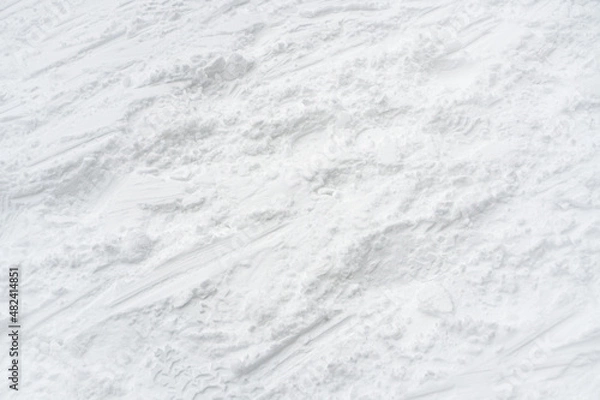 Fototapeta Snow texture background. Winter texture, snow background. Tracks on snow. 