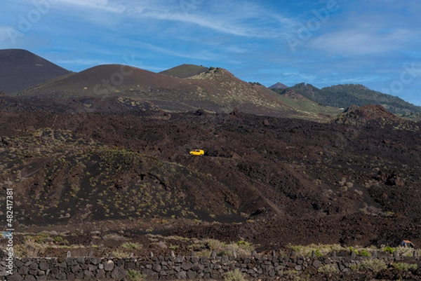 Fototapeta yellow van in a volcanic landscape in Fuencaliente, La Palma, Canary Islands