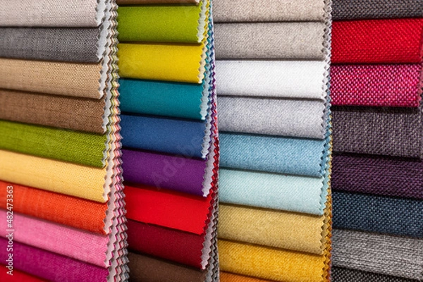 Fototapeta Colorful textile palette. Texture background. Multicolor upholstery fabric samples close-up shallow depth of field. Color selection