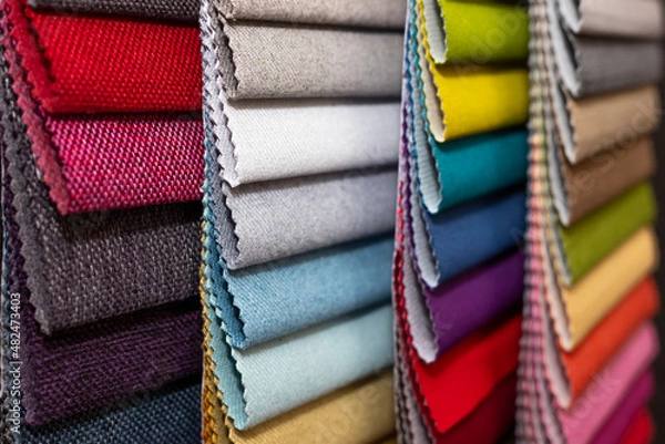 Fototapeta Colorful textile palette. Texture background. Multicolor upholstery fabric samples close-up shallow depth of field. Color selection