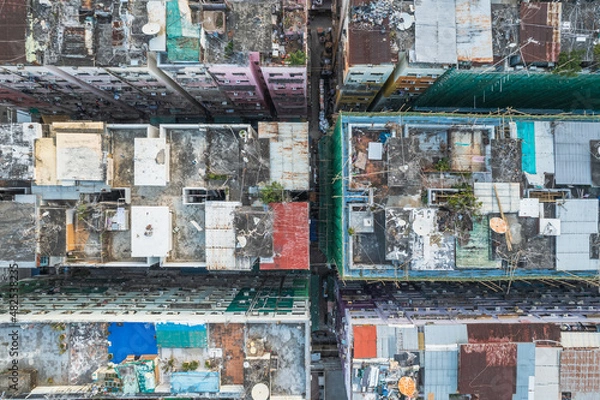Fototapeta Amazing top view of messy rooftop of old residence building in Hong Kong