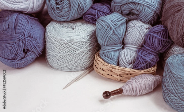 Fototapeta Craft hobby with Vintage knitting needles, yarn ball on white background, still life photo with soft focus. View from above. Handicraft day concept. space text. Crochet background blue Pastel theme.