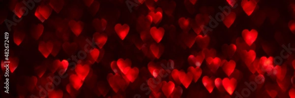 Fototapeta Red hearts, sparkling glitter bokeh background texture. Holiday valentines day lights. Abstract defocused header. Wide screen wallpaper. Panoramic web banner with copy space for design