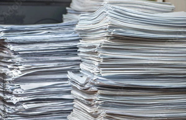 Fototapeta pile of paper documents in the office, paper trash, waste paper