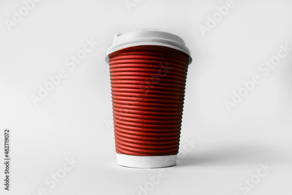 Obraz Disposable red paper cup for coffee on a gray background.
