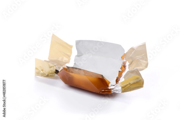Fototapeta candy brown wrapper empty and open isolated on white background with copy space for your text.