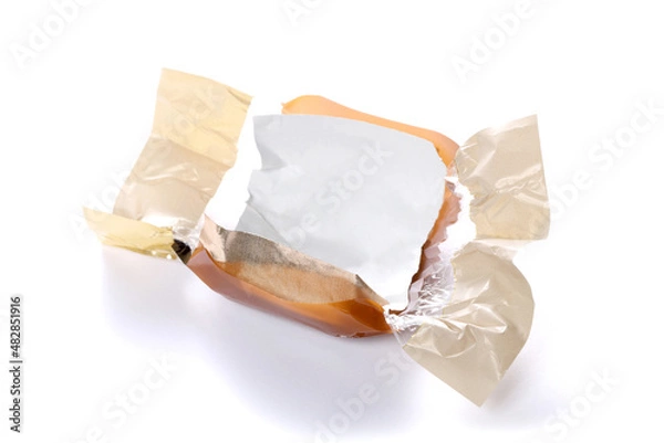 Fototapeta candy brown wrapper empty and open isolated on white background with copy space for your text.