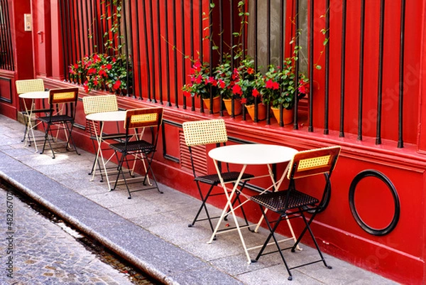 Obraz French restaurant - tables and chairs  on the street
