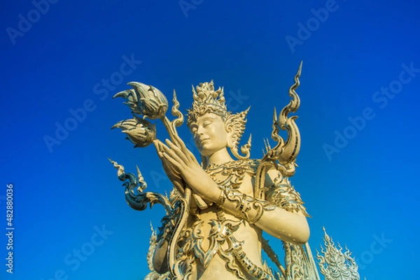 Fototapeta Wat Rong Khun,Chiangrai,in the Thailand on blue sky background.(Wide-angle lens)