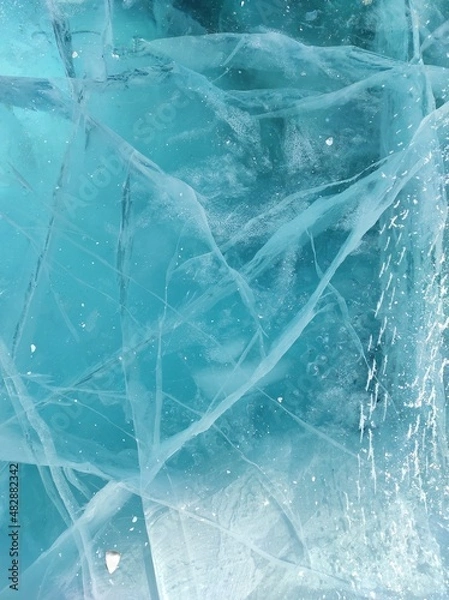 Fototapeta clear ice on a frozen lake in winter