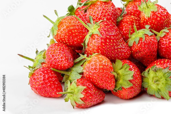 Obraz beautiful and ripe red strawberries on a white background