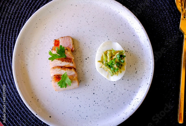 Obraz Marinated porks with Fish sauce and betel nut mix spicy sauce on the Egg
