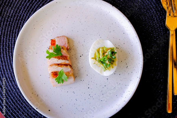 Obraz Marinated porks with Fish sauce and betel nut mix spicy sauce on the Egg
