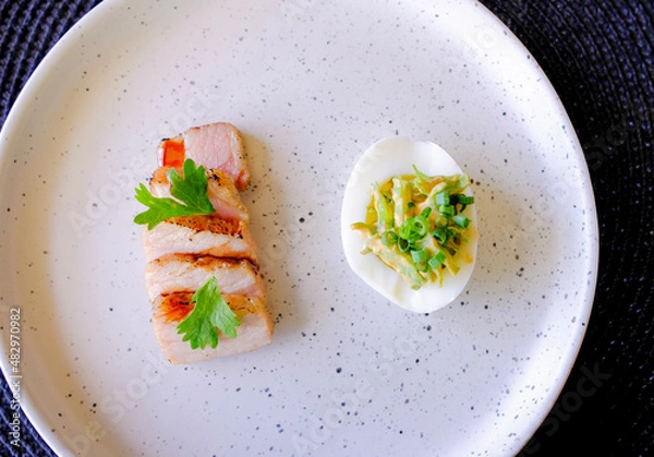 Obraz Marinated porks with Fish sauce and betel nut mix spicy sauce on the Egg
