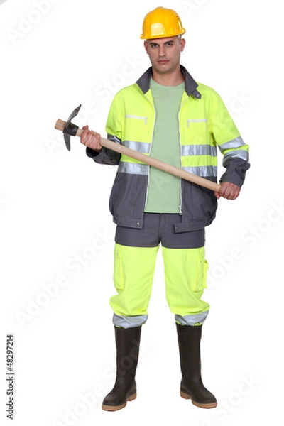 Fototapeta A man holding a pickaxe.