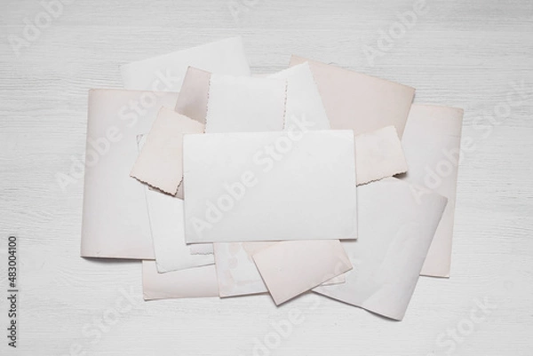 Fototapeta Blank empty photographs with copy space on the floor flat lay background. Retro style photo album template.