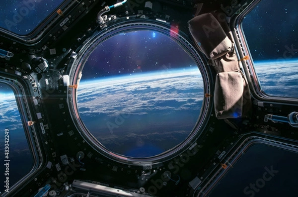 Fototapeta Earth planet in ISS porthole. View from Cupola. International space station. Orbit and atmosphere. Elements of this image furnished by NASA