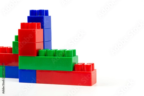 Obraz colorful wall-built building blocks isolated on white background. close-up