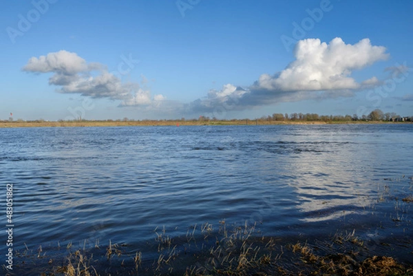 Fototapeta River IJssel near Hattem on the backgroud the "Hanzeboog bridge", Gelderland province, The Netherlands