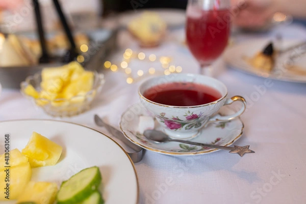 Fototapeta cup of tea and sweets